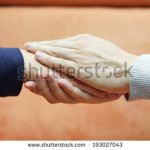 stock-photo-man-hands-holding-woman-hand-from-both-sides-compassion-and-concern-concept-193027043
